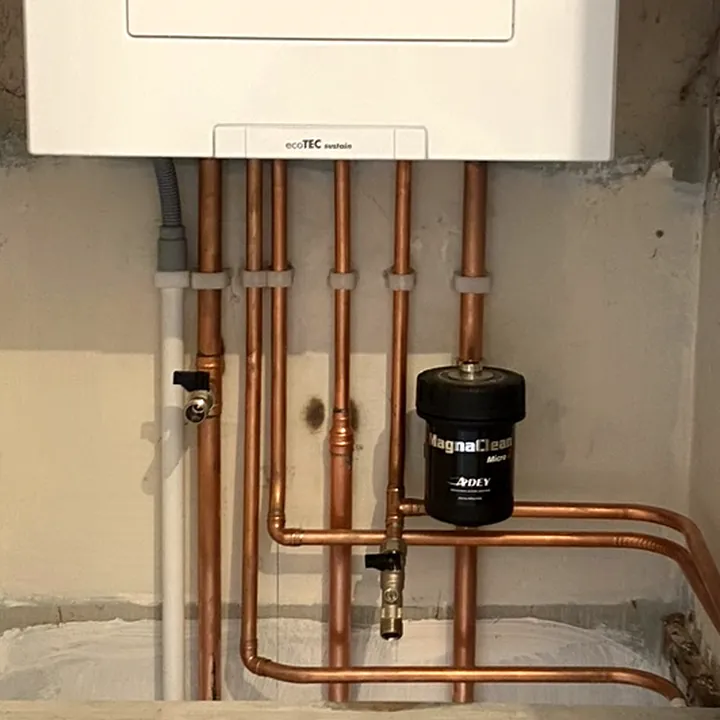 Copper tails and a magnetic system filter under a new boiler
