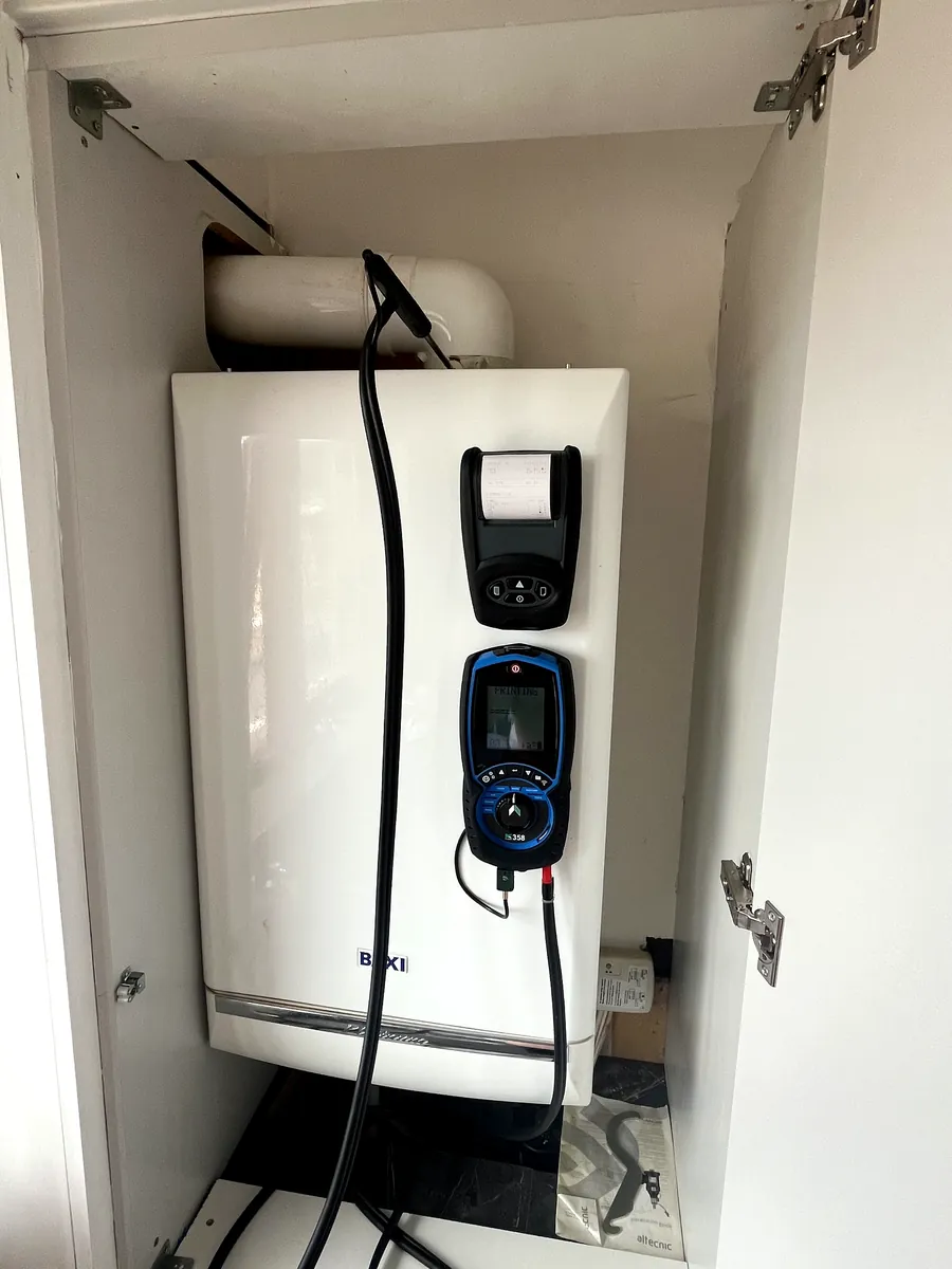 Flue gas analyser and printer on a Baxi boiler mid-test